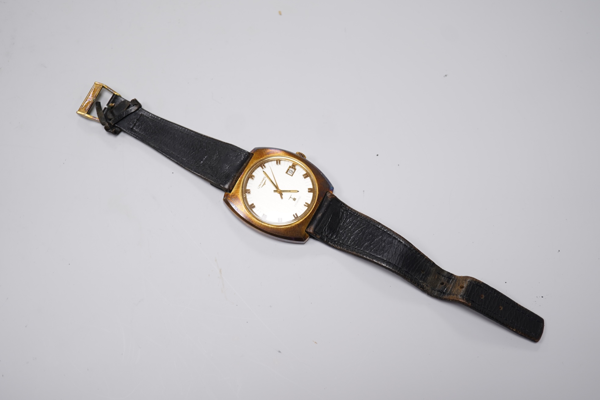 A gentleman's circa 1970'sstell and gilt Longines Ultronic quartz wrist watch, with block numerals and date aperture, movement c. 6312, case diameter 40mm, on an associated leather strap, np box or papers.